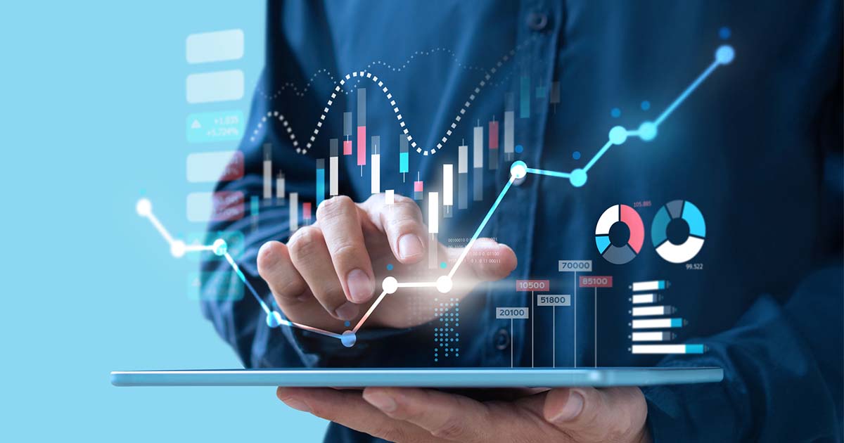 man-on-tablet-with-graphs-and-numbers-floating-above-the-tablet